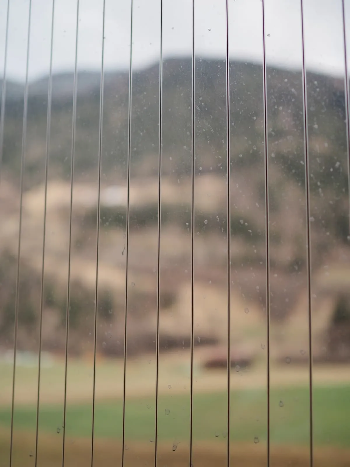 Hills seen through ribbed glass, 2026