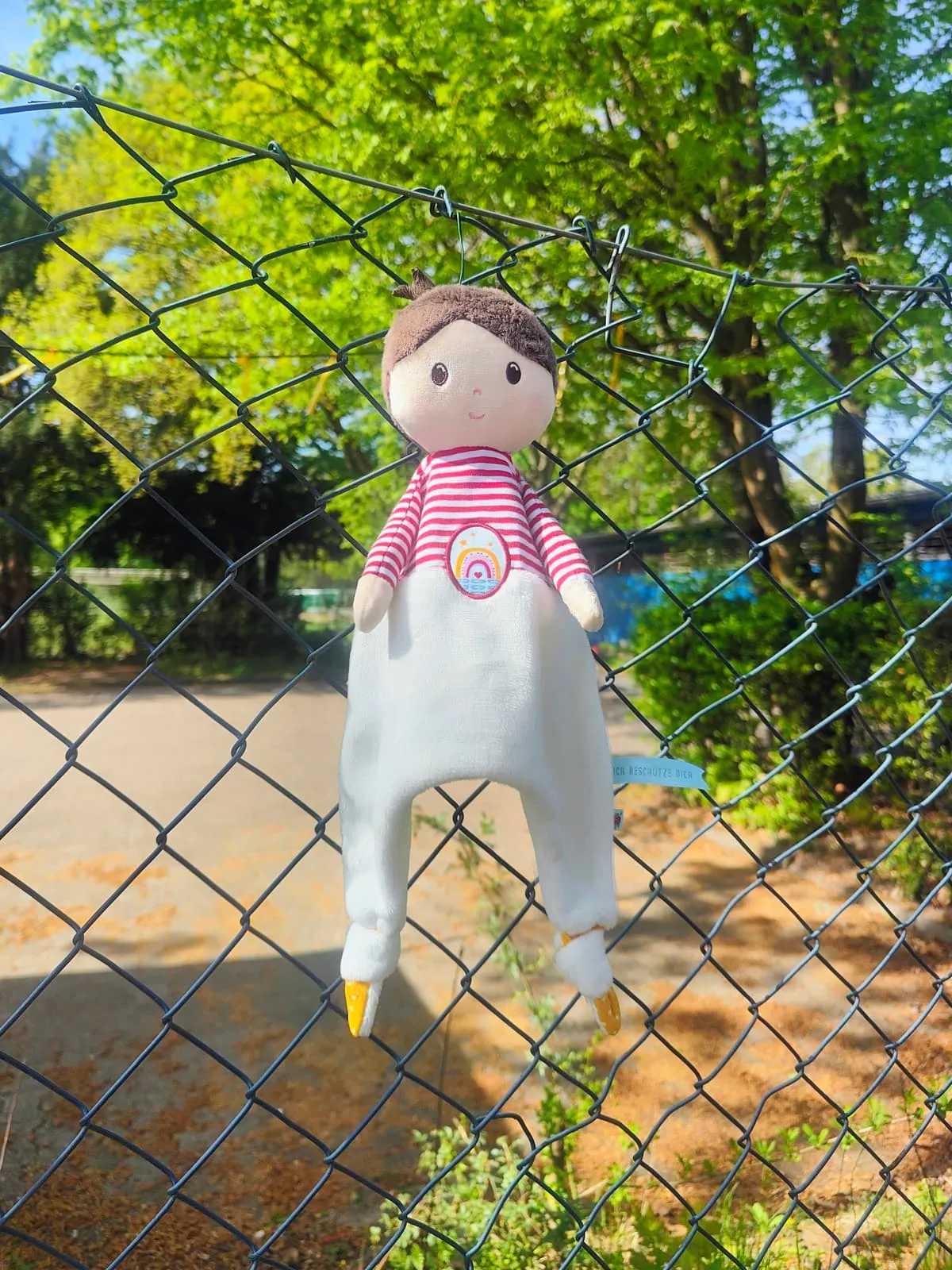 Rag doll hung in a chain link fence, 2026, Frankfurt am Main