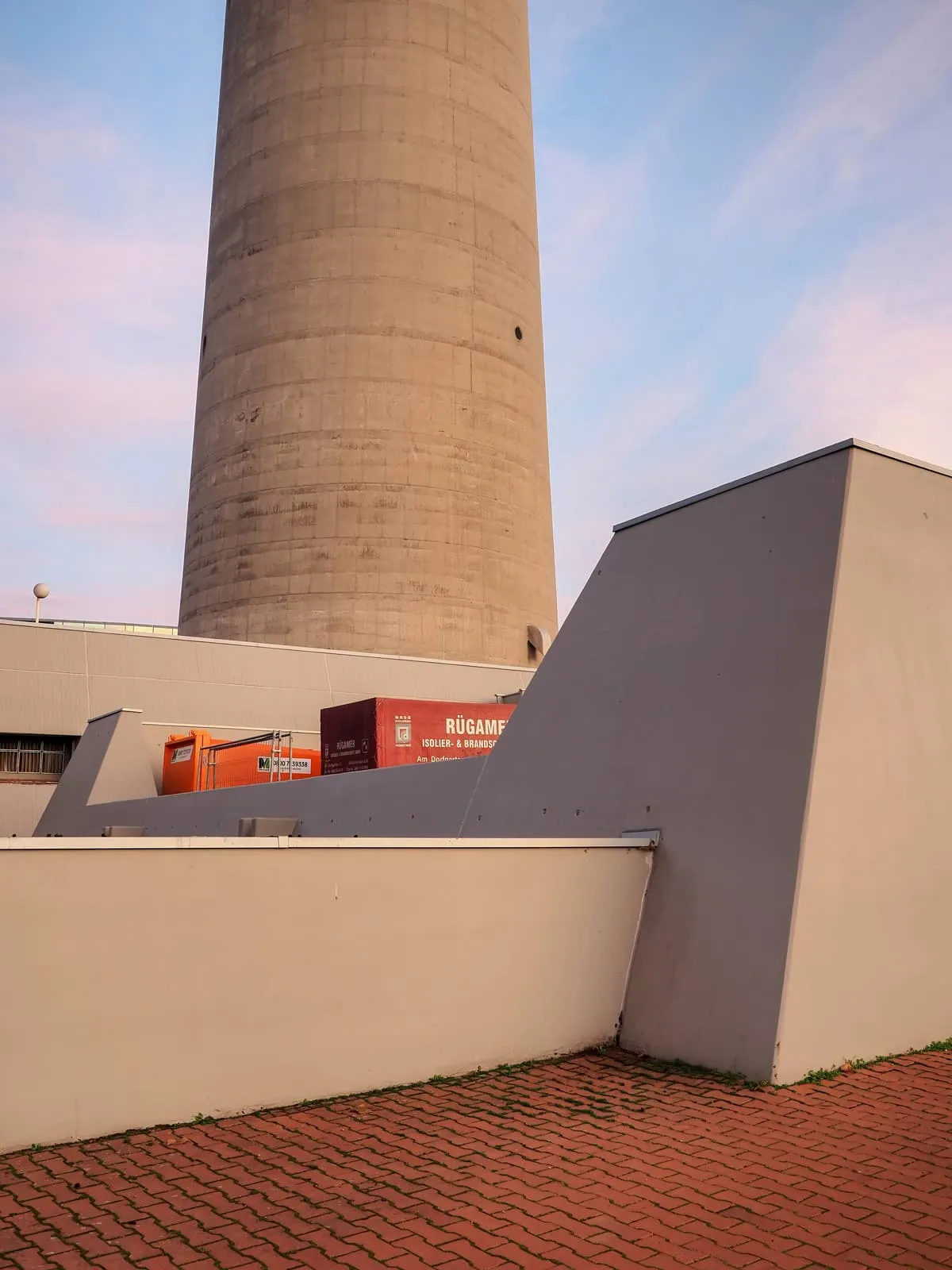 Base of a concrete tower shaft behind low grey walls, 2020, Frankfurt am Main