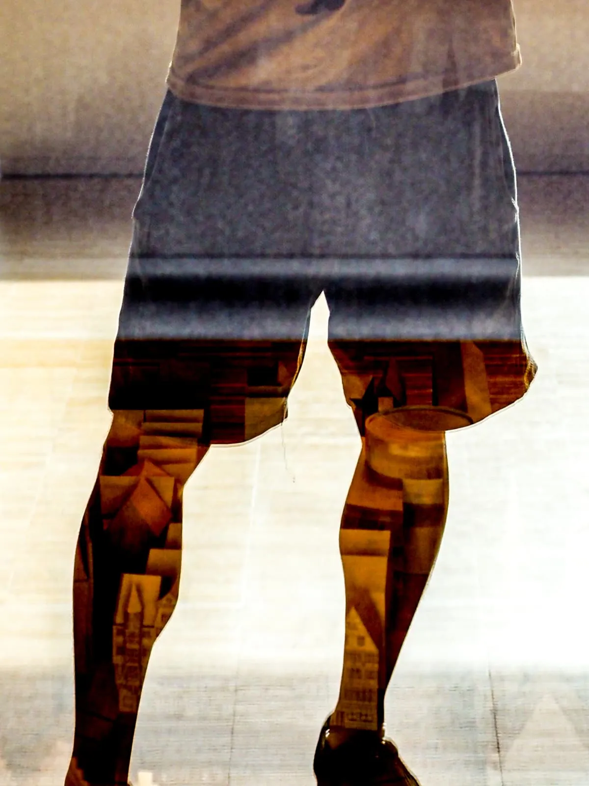 Bare legs in shorts with a picture showing through the skin, 2026