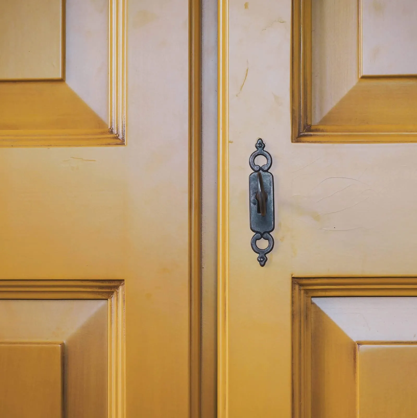 Yellow panelled double door with an old keyhole, 2020