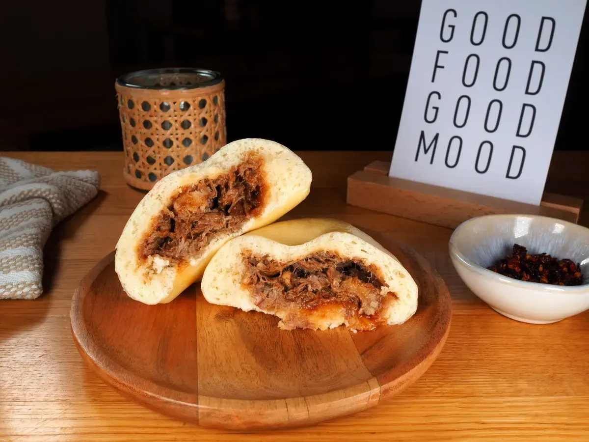 Pork adobo bun, halved